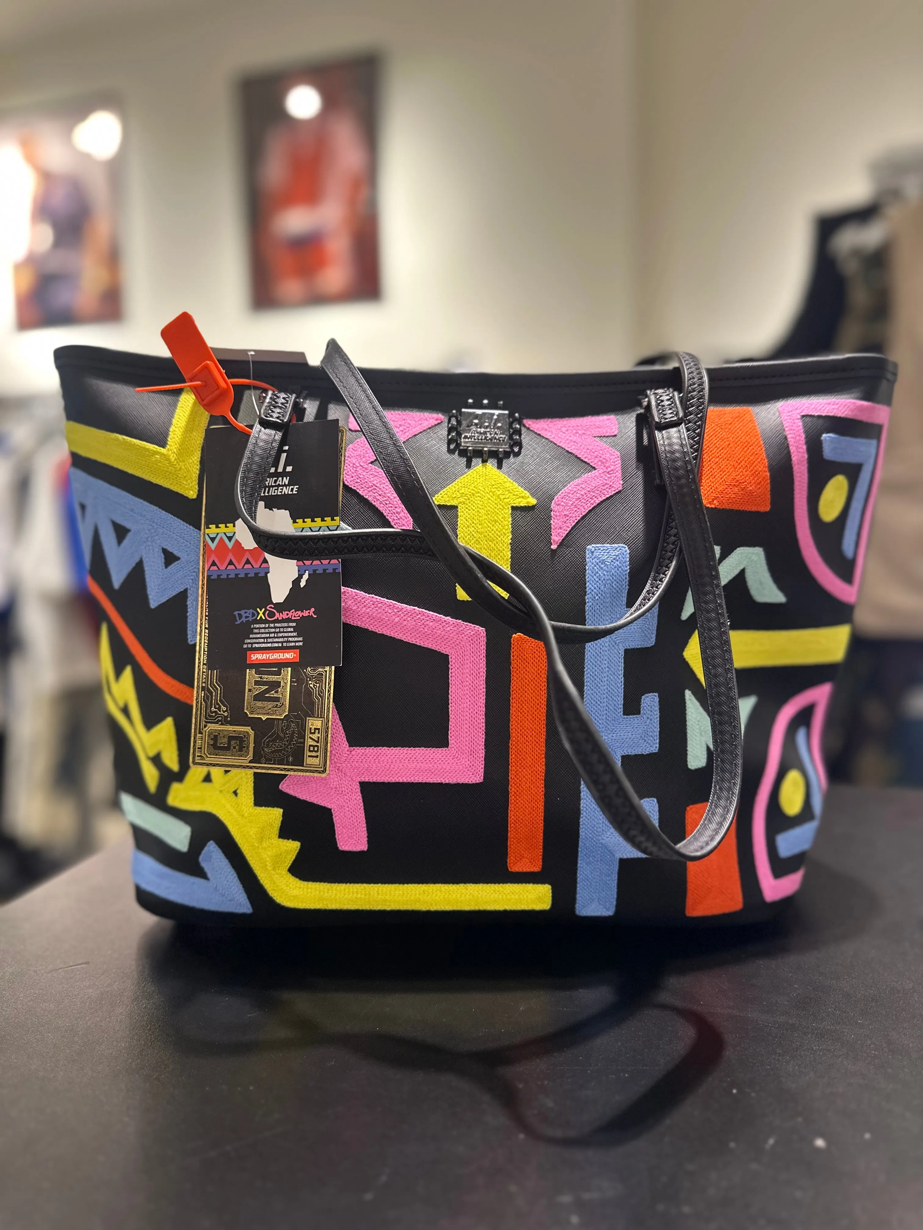 SPRAYGROUND: AFRICAN INTELLIGENCE DBD x SANDFLOWER COLLAB TOTE