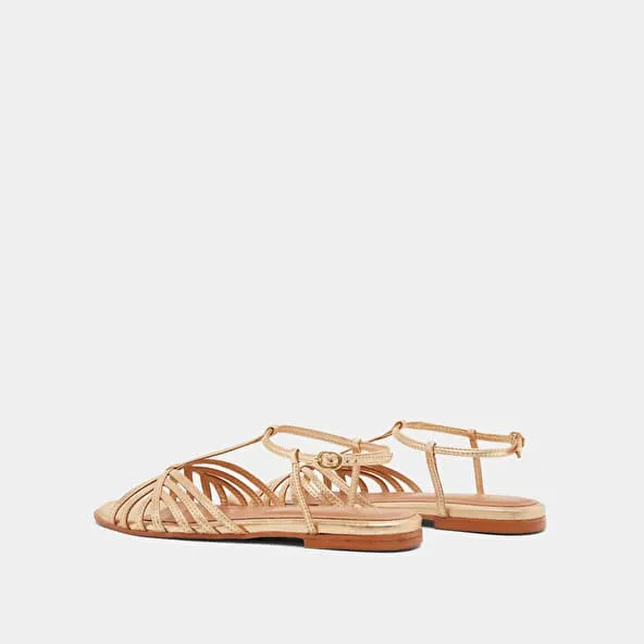 Strapped sandals in gold metallic leather